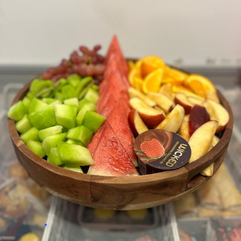 DIY Invasion's catering called Fruits Platter featuring assorted watermelon, apples, grapes, oranges.