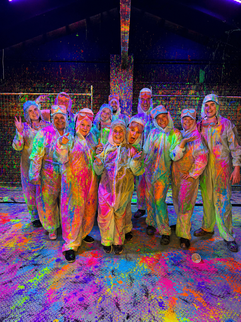 A team bonding session of adults in Splatter & Splash room at DIY Invasion